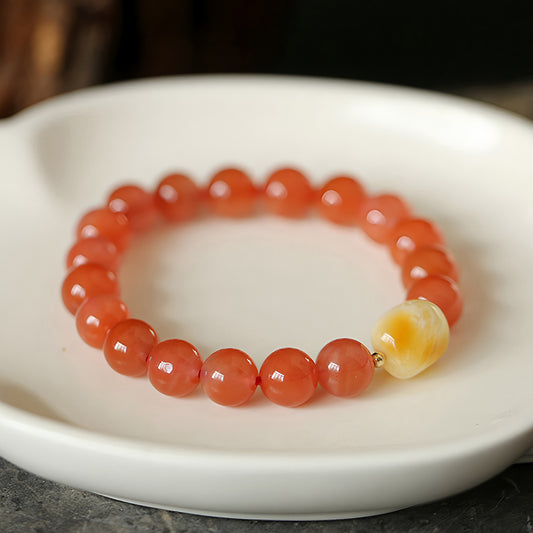 Natural red jade and beeswax beaded bracelet